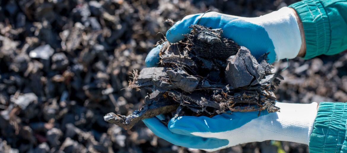 Close,Up,Of,Man,Holding,Pieces,Of,Shredded,Tires