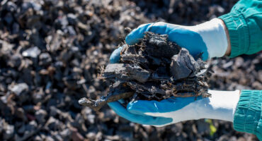 Close,Up,Of,Man,Holding,Pieces,Of,Shredded,Tires